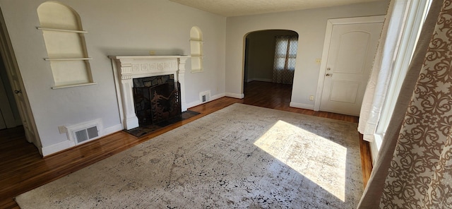 108 Parkview Dr, Waynesboro, VA 22980 - unfurnished living room with visible vents, wood finished floors, and arched walkways