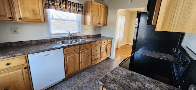 108 Parkview Dr, Waynesboro, VA 22980 - kitchen with baseboards, black appliances, dark countertops, and a sink
