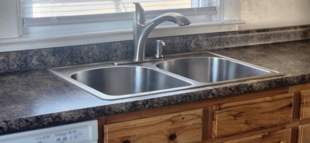 108 Parkview Dr, Waynesboro, VA 22980 - room details with a sink, dark countertops, white dishwasher, and brown cabinets
