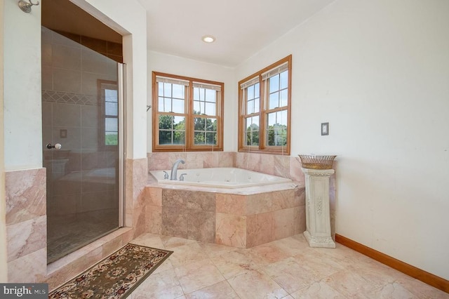 11425 Custers Trce, Spotsylvania, VA 22553 - bathroom with a bath, a shower stall, and baseboards