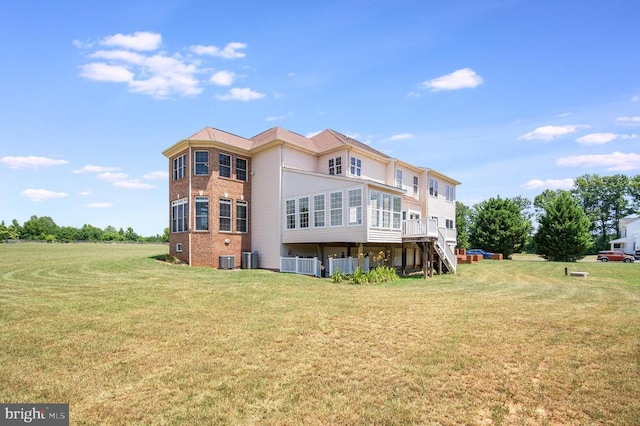 11425 Custers Trce, Spotsylvania, VA 22553 - back of property featuring brick siding, a yard, and cooling unit