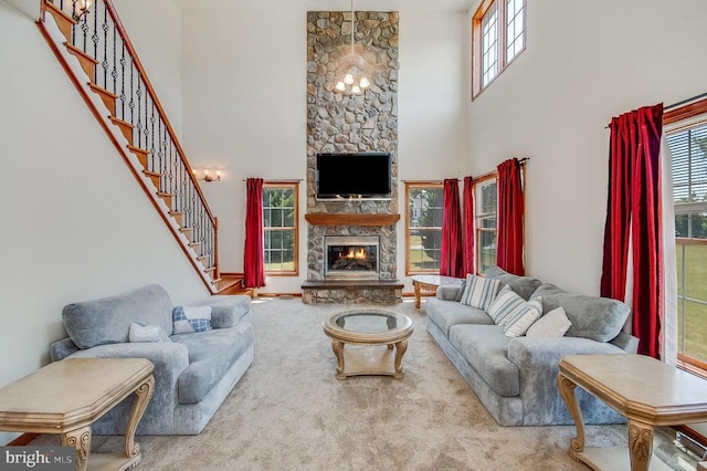 11425 Custers Trce, Spotsylvania, VA 22553 - living area with a towering ceiling, a stone fireplace, carpet, healthy amount of natural light, and stairway