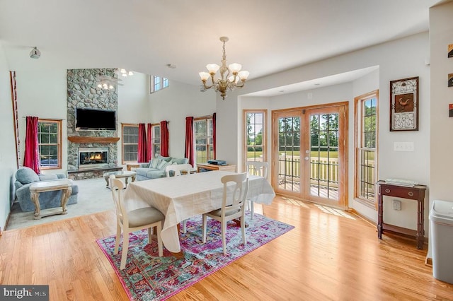 11425 Custers Trce, Spotsylvania, VA 22553 - dining room featuring a chandelier, wood finished floors, and a fireplace