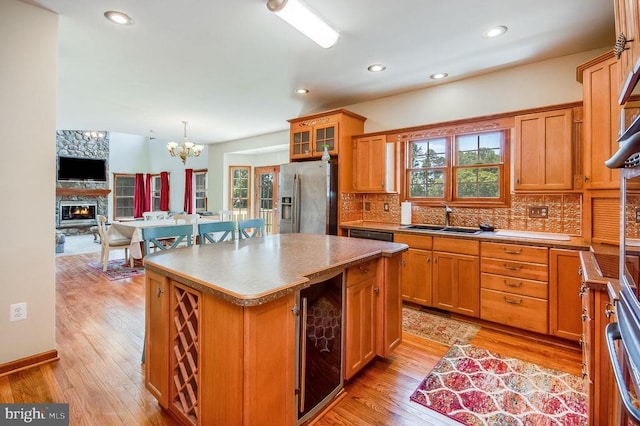 11425 Custers Trce, Spotsylvania, VA 22553 - kitchen with stainless steel fridge with ice dispenser, a sink, wine cooler, plenty of natural light, and recessed lighting