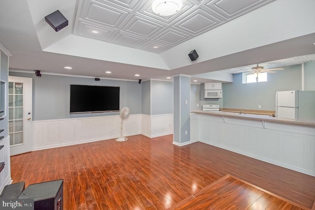 11425 Custers Trce, Spotsylvania, VA 22553 - unfurnished living room with wood-type flooring, a ceiling fan, wainscoting, recessed lighting, and an ornate ceiling