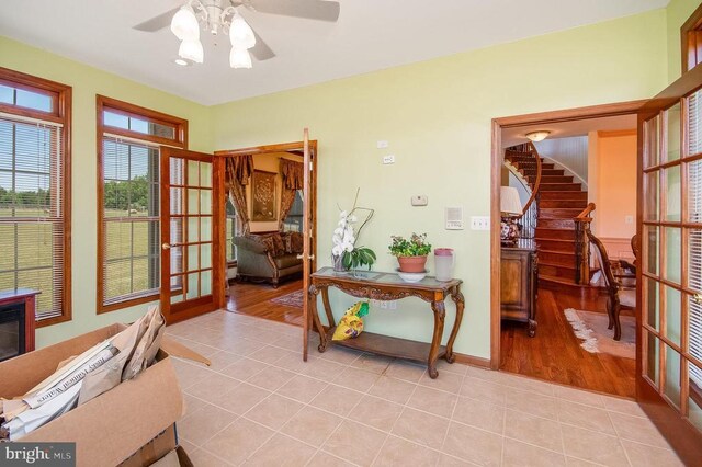 11425 Custers Trce, Spotsylvania, VA 22553 - sitting room with light tile patterned flooring, ceiling fan, stairway, french doors, and baseboards