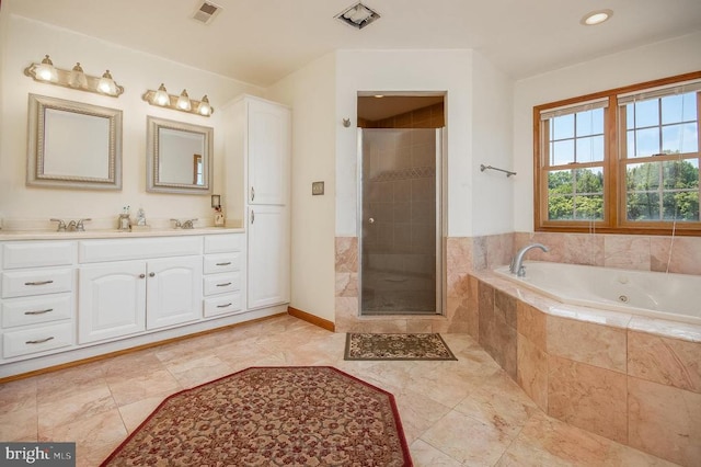 11425 Custers Trce, Spotsylvania, VA 22553 - full bathroom with a tub with jets, a stall shower, double vanity, and baseboards