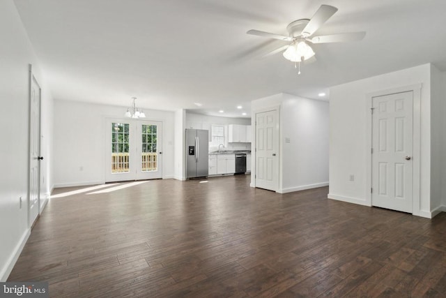 19523 Swamp Poodle Ln, Brandy Station, VA 22714 - unfurnished living room with a chandelier, ceiling fan, baseboards, dark wood-type flooring, and recessed lighting