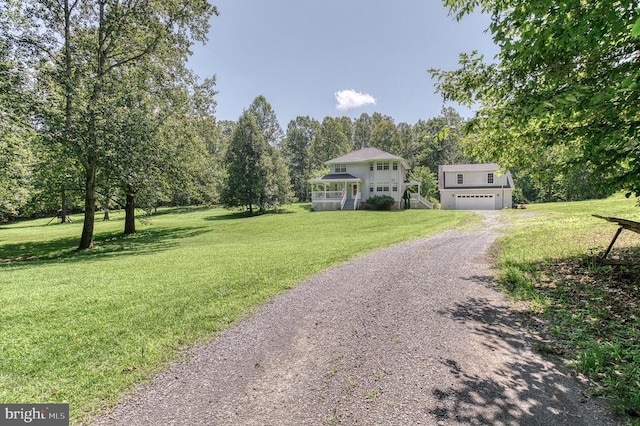 5575 Jeffersonton Rd, Jeffersonton, VA 22724 - colonial home with gravel driveway, an attached garage, and a front yard