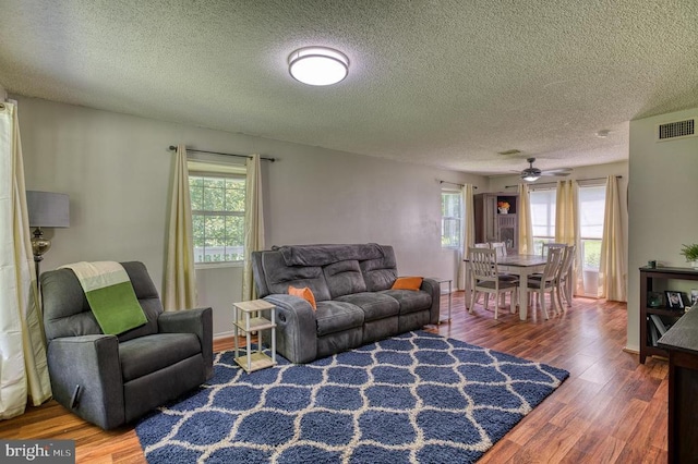 5575 Jeffersonton Rd, Jeffersonton, VA 22724 - living area featuring wood finished floors, ceiling fan, and a textured ceiling