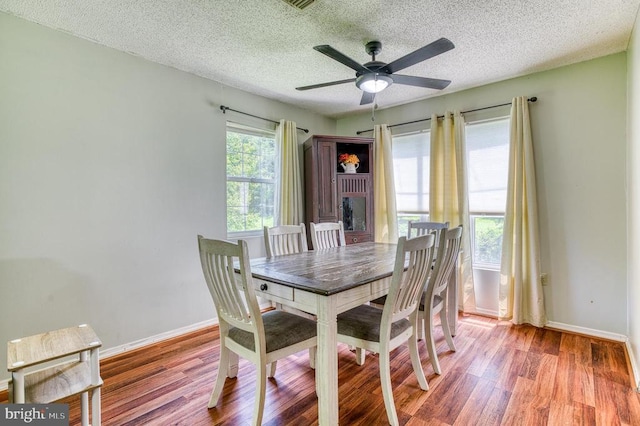 5575 Jeffersonton Rd, Jeffersonton, VA 22724 - dining space with a textured ceiling, wood finished floors, and a ceiling fan