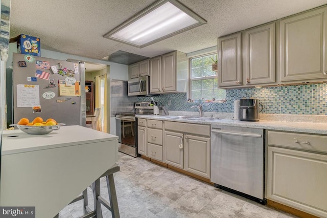 5575 Jeffersonton Rd, Jeffersonton, VA 22724 - kitchen with appliances with stainless steel finishes, a textured ceiling, light countertops, and decorative backsplash