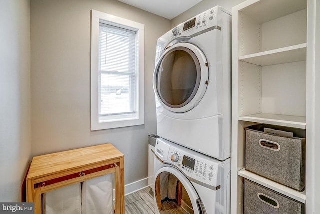 310 Elk Creek Lndg, Mineral, VA 23117 - laundry room with stacked washing machine and dryer, plenty of natural light, and baseboards
