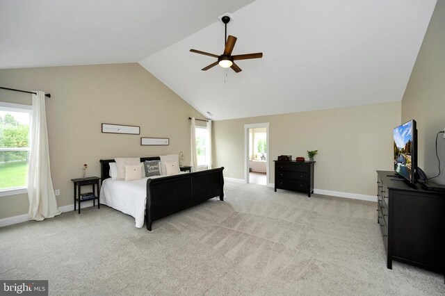  - bedroom featuring vaulted ceiling, light carpet, baseboards, and ceiling fan