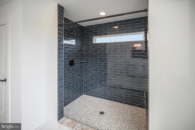  - bathroom with a tile shower and recessed lighting