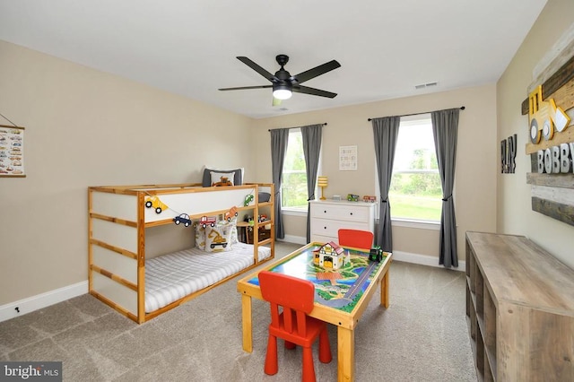  - bedroom featuring baseboards, carpet, and a ceiling fan