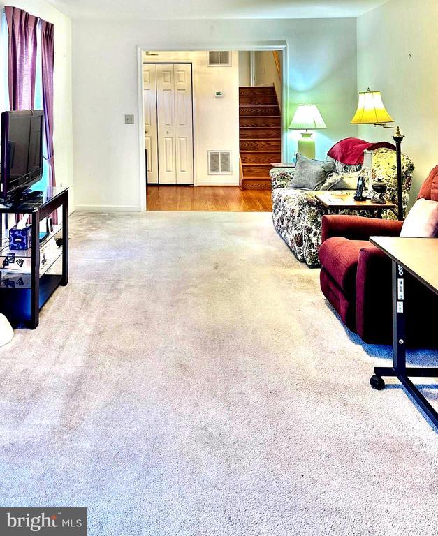 26 Magnolia Ct, Barboursville, VA 22923 - carpeted living room with stairway