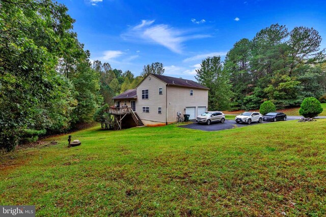26 Magnolia Ct, Barboursville, VA 22923 - rear view of house featuring stairway, an attached garage, driveway, a lawn, and a deck