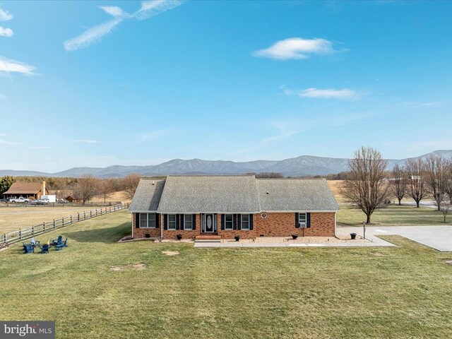 237 Preston Ln, Luray, VA 22835 - back of property featuring a mountain view, a porch, brick siding, and a shingled roof