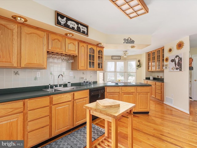 237 Preston Ln, Luray, VA 22835 - kitchen with a sink, light wood-style floors, dark countertops, and glass insert cabinets