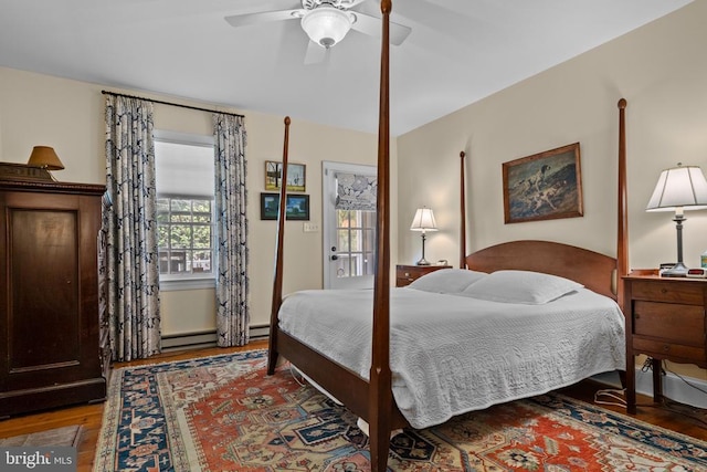  - bedroom with wood finished floors and ceiling fan