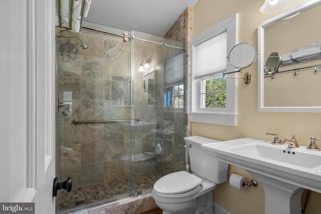  - full bathroom with a shower stall and toilet