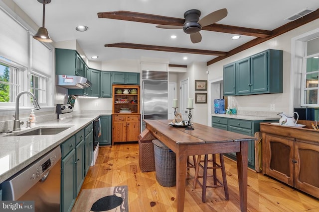  - kitchen with a sink, appliances with stainless steel finishes, exhaust hood, ceiling fan, and beam ceiling