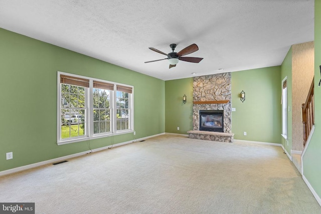 2703 Schumann St, Fredericksburg, VA 22408 - unfurnished living room with ceiling fan, a fireplace, carpet floors, and a textured ceiling