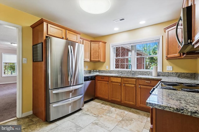 3200 Lafayette Blvd, Fredericksburg, VA 22408 - kitchen featuring appliances with stainless steel finishes, stone countertops, brown cabinetry, and recessed lighting