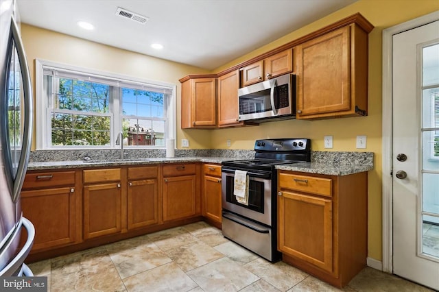 3200 Lafayette Blvd, Fredericksburg, VA 22408 - kitchen with appliances with stainless steel finishes, brown cabinets, stone counters, and recessed lighting