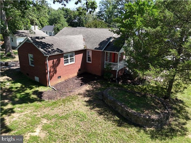 3200 Lafayette Blvd, Fredericksburg, VA 22408 - view of side of home featuring crawl space, brick siding, a shingled roof, a lawn, and view of wooded area