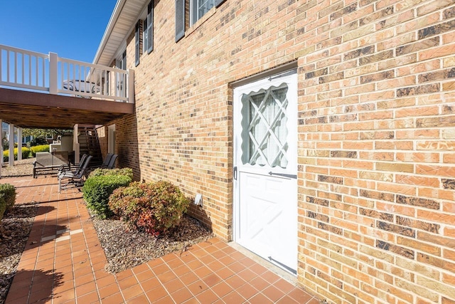 232 Edgewood Dr, Shenandoah, VA 22849 - view of exterior entry with brick siding and a wooden deck