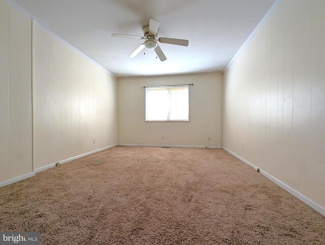 2104 Jefferson Park Ave Unit D, Charlottesville, VA 22903 - carpeted spare room with crown molding, a ceiling fan, and wooden walls