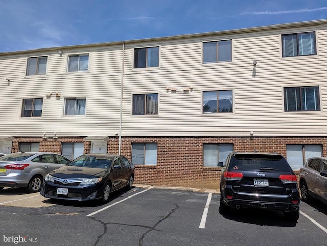 2104 Jefferson Park Ave Unit D, Charlottesville, VA 22903 - view of building exterior featuring uncovered parking