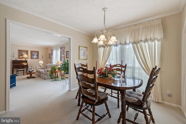 731 Bluewater Blvd S, Mineral, VA 23117 - dining room with light colored carpet, ornamental molding, a notable chandelier, and baseboards