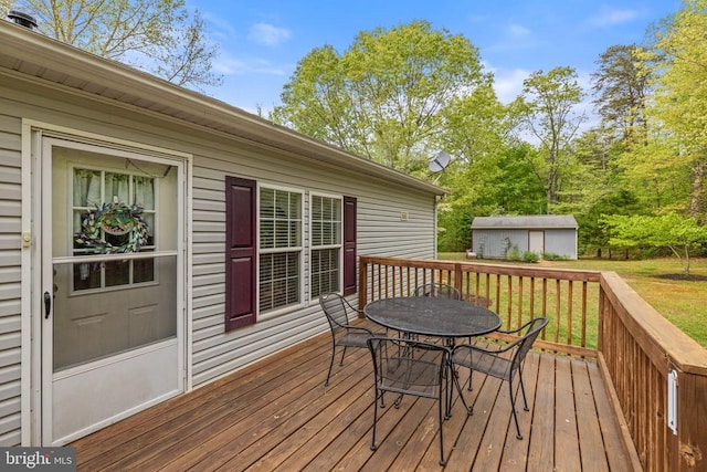731 Bluewater Blvd S, Mineral, VA 23117 - deck featuring a yard, an outdoor structure, and outdoor dining area