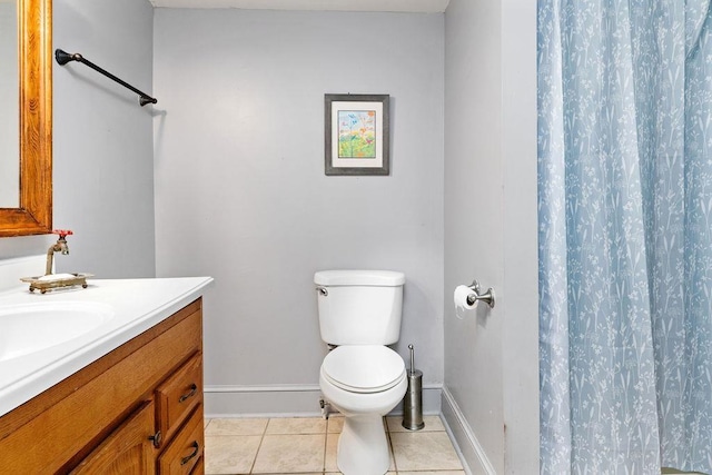 bathroom featuring tile patterned floors, toilet, curtained shower, and vanity