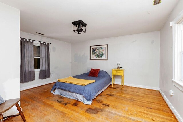 bedroom featuring wood-type flooring