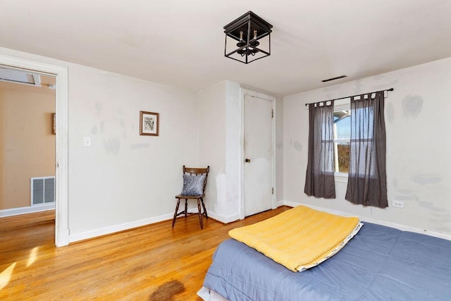 bedroom with wood-type flooring