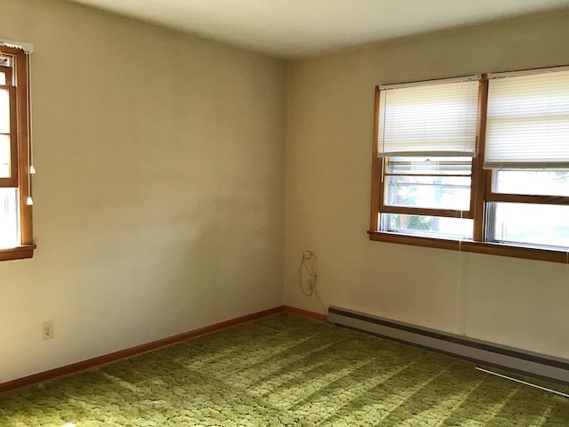 unfurnished room featuring a baseboard radiator, carpet flooring, and baseboards