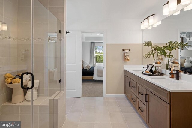 10100 N Streamview Ct, Fredericksburg, VA 22408 - ensuite bathroom featuring a stall shower, double vanity, tile patterned floors, and baseboards