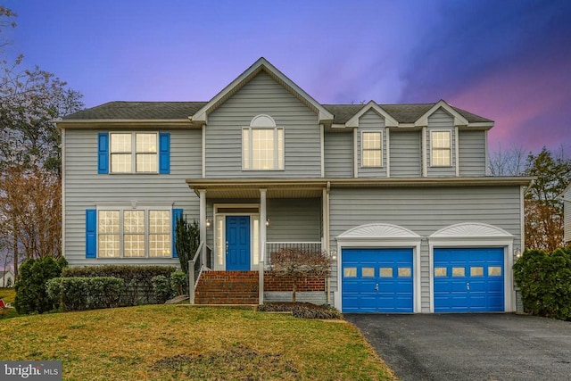 11218 Glen Park Dr, Fredericksburg, VA 22407 - view of front facade with a garage, driveway, and a front yard