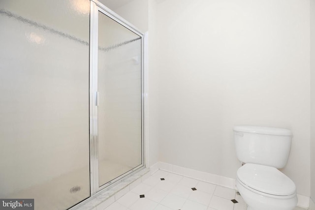 11218 Glen Park Dr, Fredericksburg, VA 22407 - full bath featuring a stall shower, toilet, baseboards, and tile patterned flooring