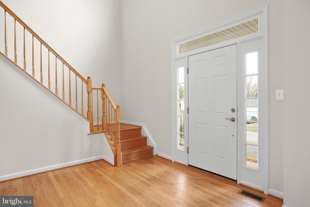 11218 Glen Park Dr, Fredericksburg, VA 22407 - entrance foyer with baseboards, plenty of natural light, wood finished floors, and stairway