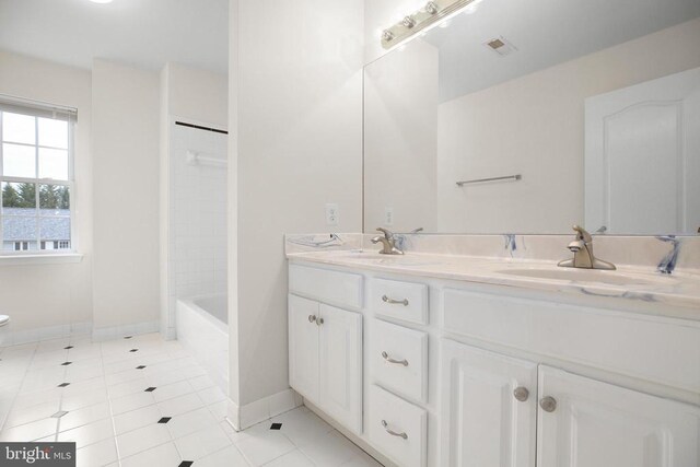 11218 Glen Park Dr, Fredericksburg, VA 22407 - full bath featuring tile patterned floors, double vanity, baseboards, and toilet
