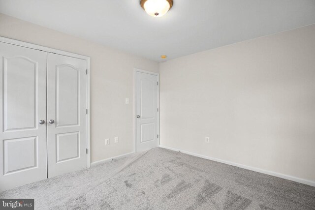 11218 Glen Park Dr, Fredericksburg, VA 22407 - unfurnished bedroom featuring carpet floors, a closet, and baseboards