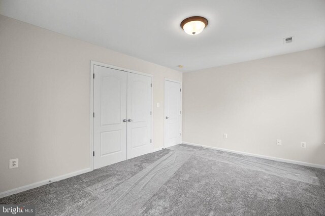 11218 Glen Park Dr, Fredericksburg, VA 22407 - unfurnished bedroom with carpet, baseboards, and a closet