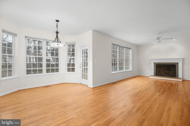 11218 Glen Park Dr, Fredericksburg, VA 22407 - unfurnished living room featuring ceiling fan, light wood-style flooring, and plenty of natural light