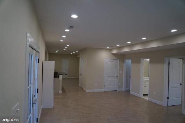11218 Glen Park Dr, Fredericksburg, VA 22407 - unfurnished room with recessed lighting, baseboards, and light wood-style flooring