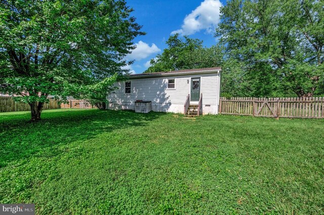11803 Oakdale Ct, Locust Grove, VA 22508 - rear view of house featuring entry steps, a fenced backyard, and crawl space